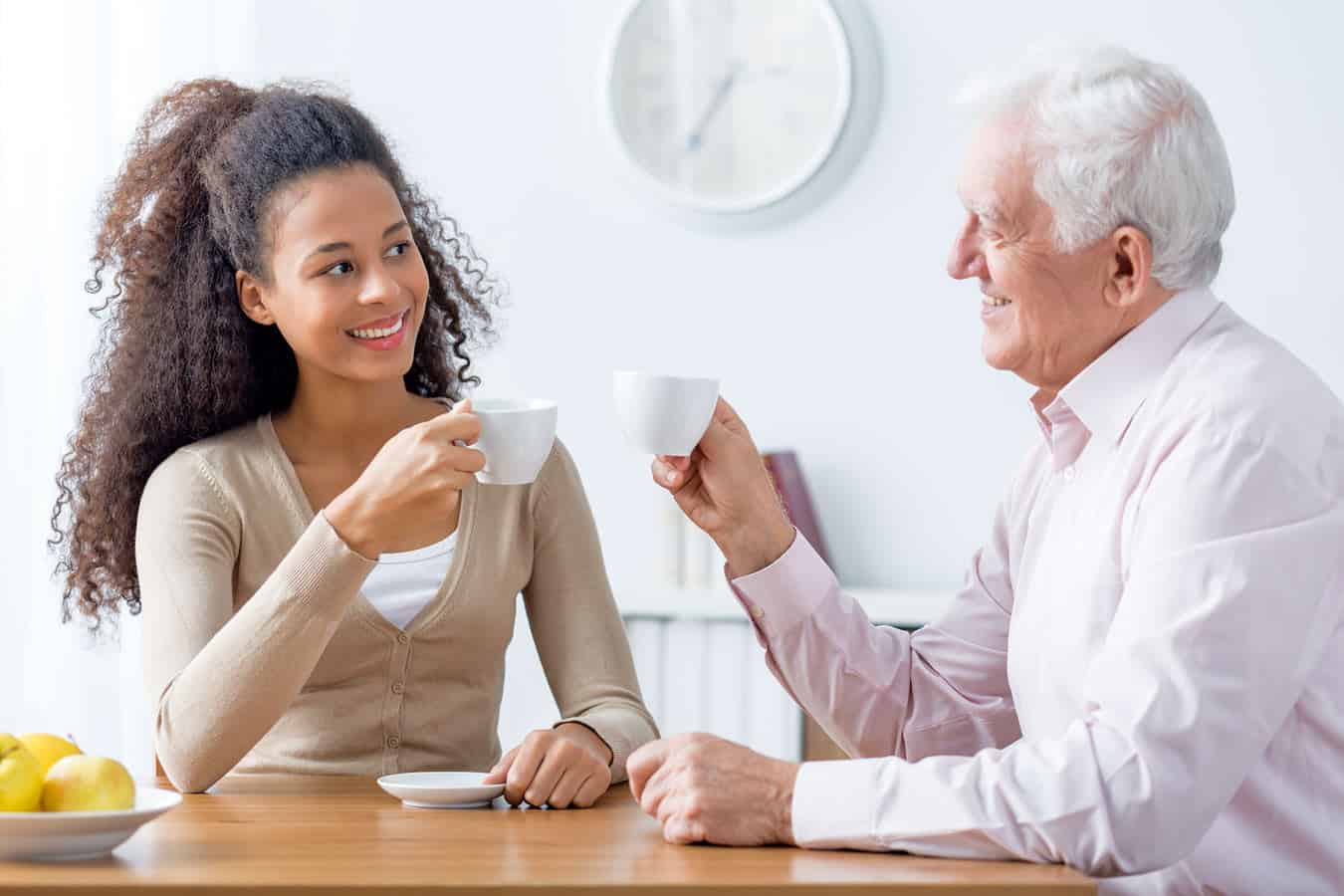 elderly-man-celebrating-coffee-with-granddaughter-after-escaping-the-clutches-of-timeshare-sales-scams