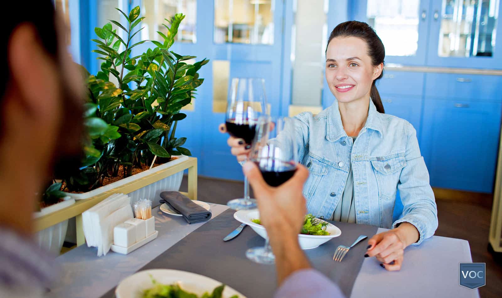 woman-cheersing-husband-during-vacation-after-booking-travel-club-trip-after-canceling-timeshare-agreement-with-voc