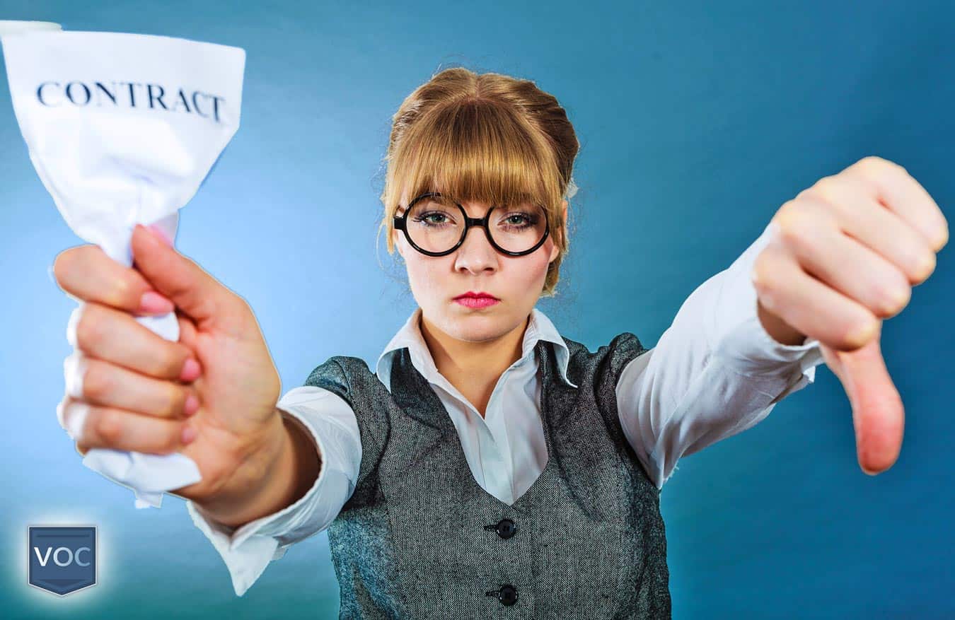 woman-crumpling-timeshare-contract-with-thumbs-down-and-blue-background-in-weater-vest