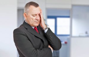 news-headline-image-of-man-with-hand-on-face-due-to-regret-of-not-getting-timeshare-refund-from-resort-after-promised