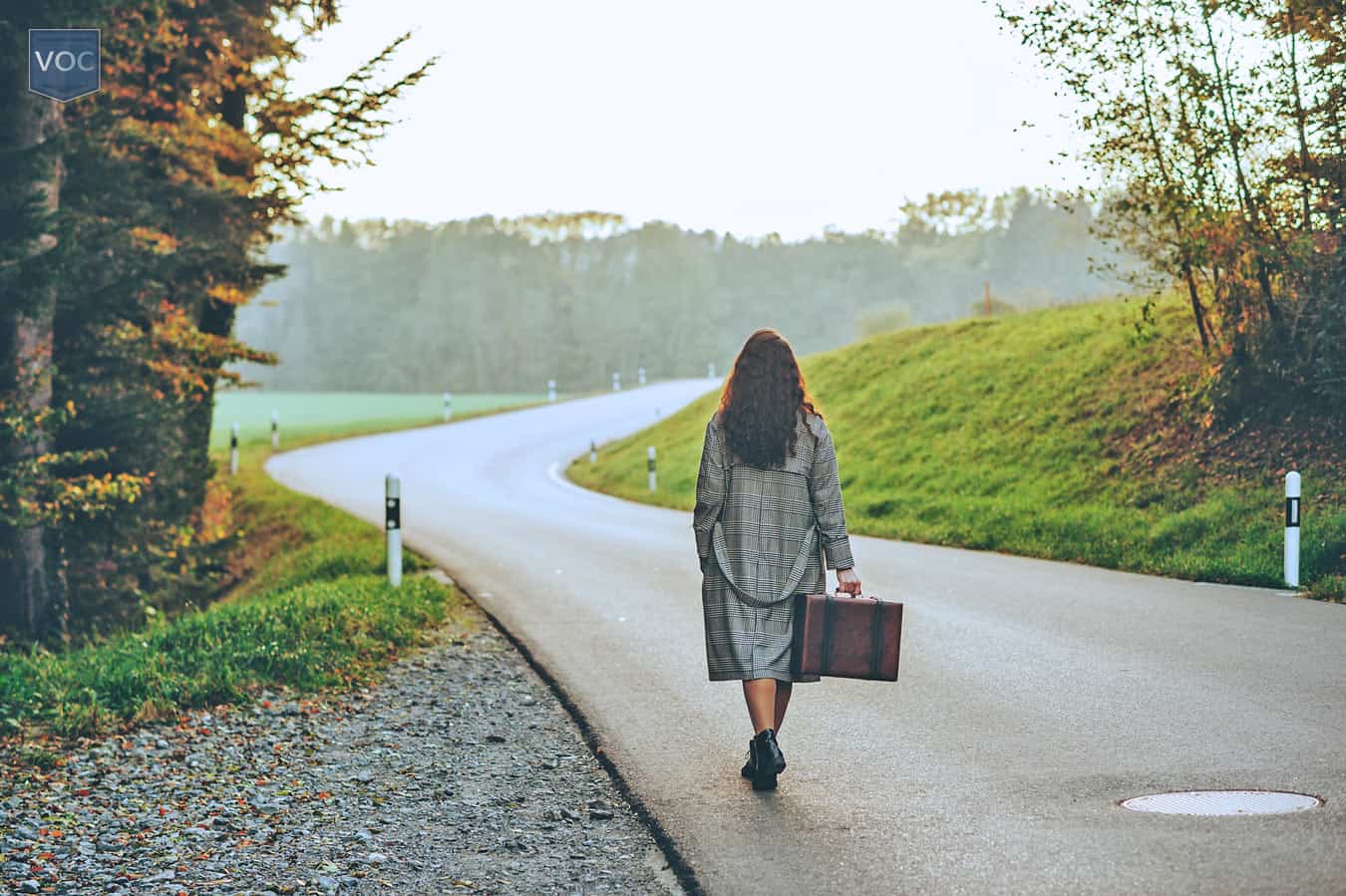 woman-with-suitcase-walking-away-from-timeshare-agreement-for-good-instead-of-continuously-experiencing-the-same-travel-limitations