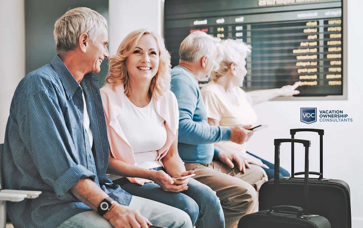 happy-couple-preparing-to-travel-somewhere-excited-for-vacation-in-airport