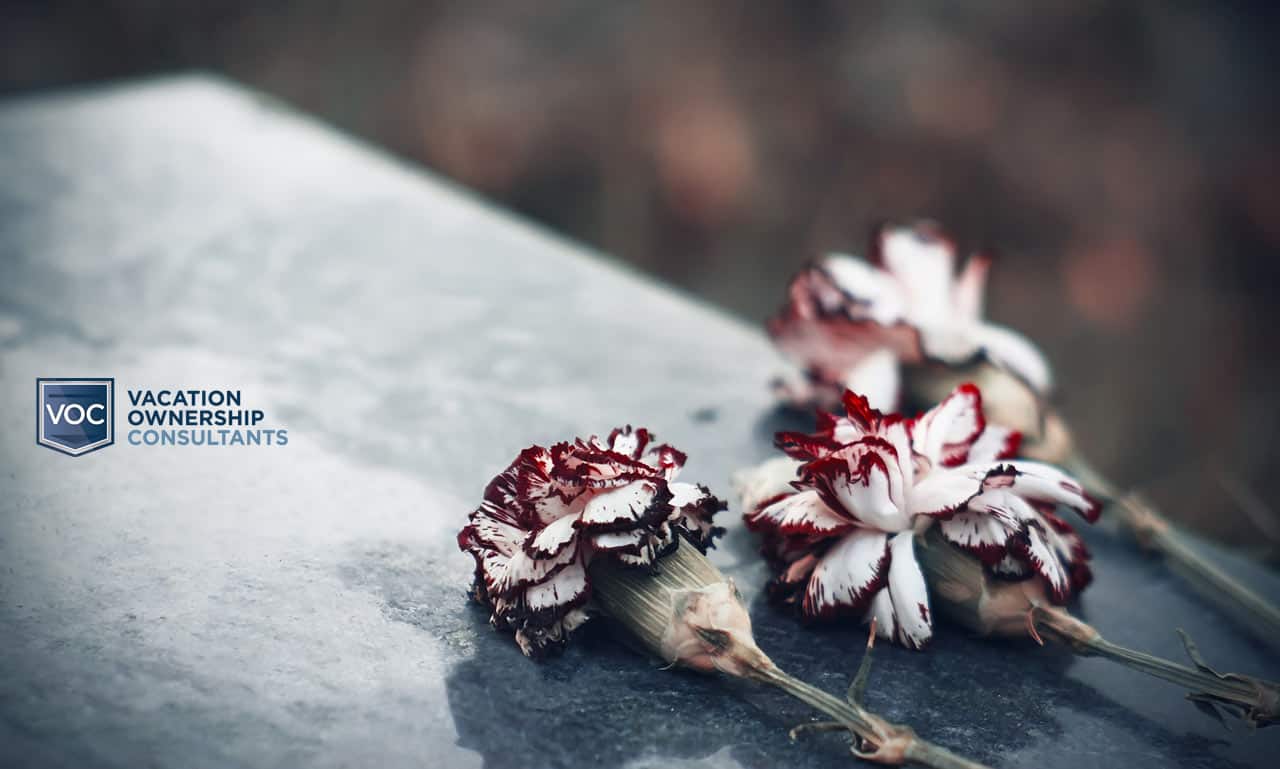 image-of-a-casket-on-gloomy-day-with-flowers-for-voc-article-depicting-the-death-of-a-family-member-and-inheriting-timeshare-contract-by-abc-article