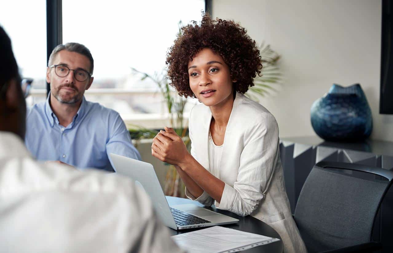 interesting-middle-aged-woman-with-white-husband-speaking-to-sales-staff-about-potential-timeshare-relief-options