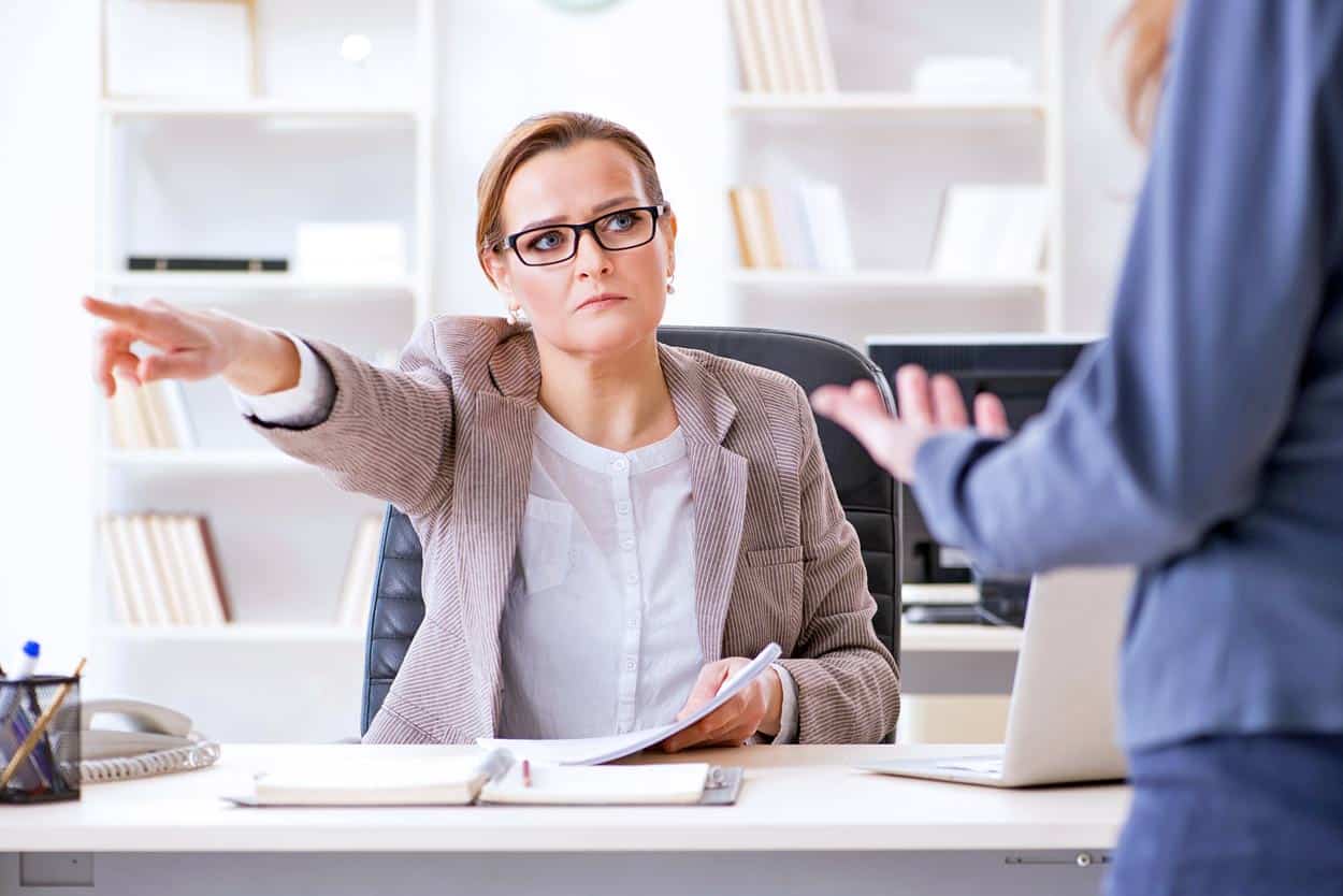 boss-lady-in-glassess-firing-employee-pointing-to-the-door-not-hearing-excuses-for-misconduct