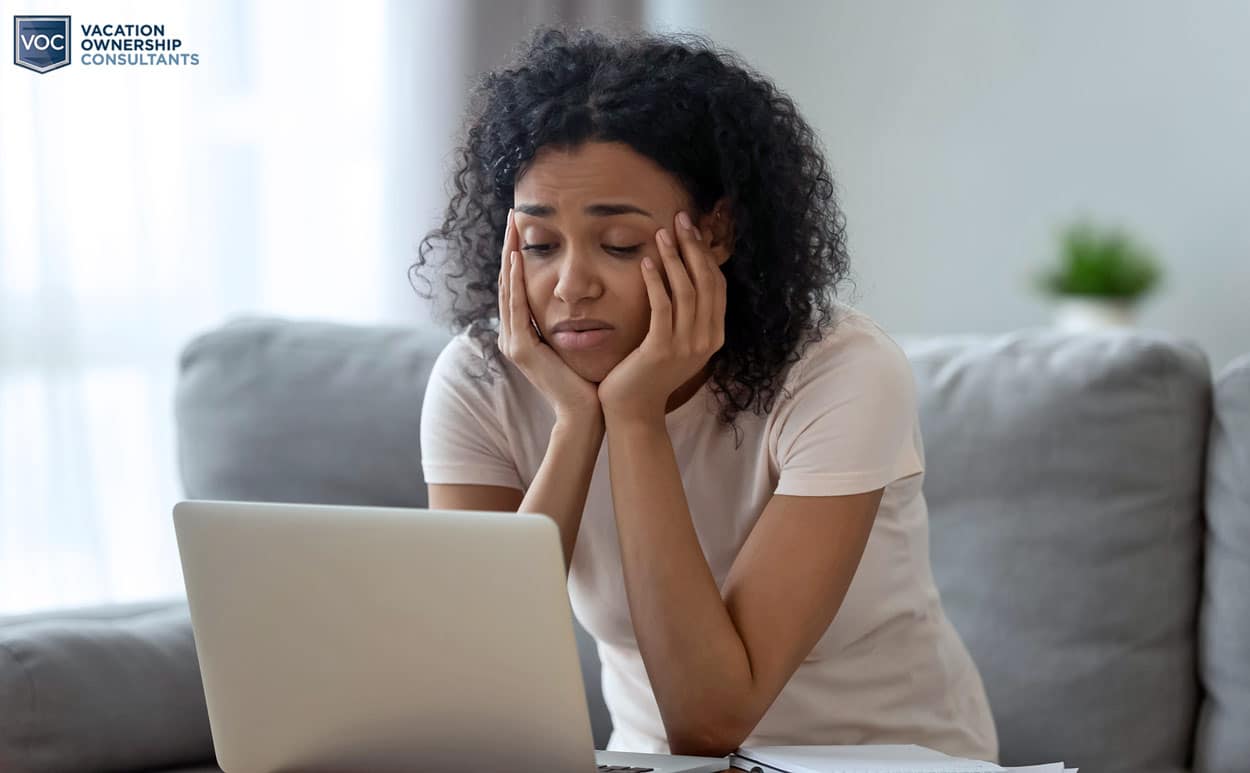 disappointed-woman-with-curly-hair-sighing-by-computer-screen-thinking-she-has-no-options-but-cross-fingers-bad-odds