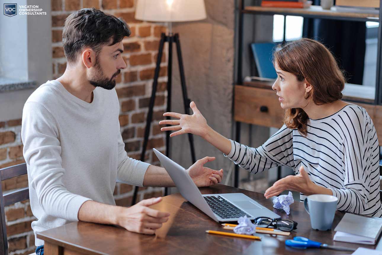 middle-age-couple-arguing-about-timeshare-mortgage-while-on-computer-re-thinking-the-bad-decision-to-purchase-at-home