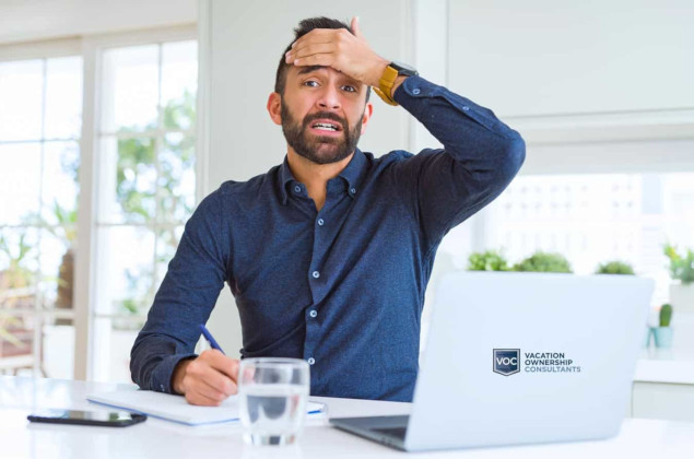 man with hand on head regretting timeshare