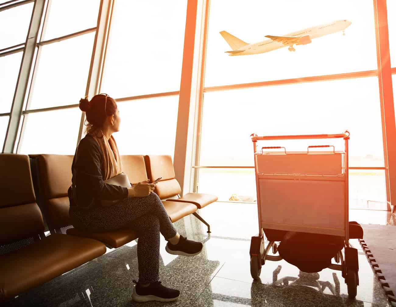 Woman at airport travelling to timeshare